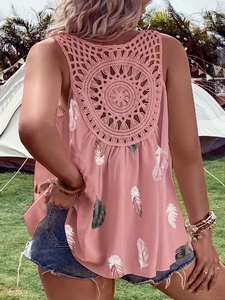 Close-up of bohemian pink tank top featuring intricate crochet lace hollow back design
