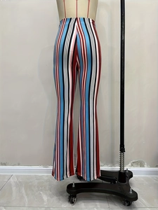 Hippie style high waisted bell bottom pants with colorful vertical striped patterns