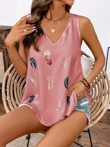 Detail of pink satin V-neck sleeveless top with feather print and lace hollow-out straps