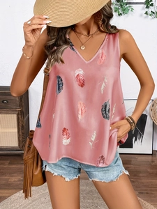 Close-up of V-neck top with feather print and delicate lace trim in a vacation style