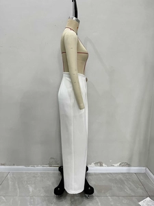 Side view of high-waist white wide-leg trousers showing drape and tailored fit on a mannequin