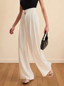 Elegant high-waisted wide-leg white trousers with asymmetric waist and gold button