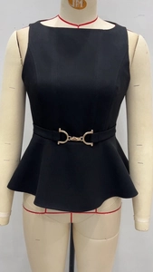Detail of black peplum top with sleeveless design and golden equestrian buckle waist belt