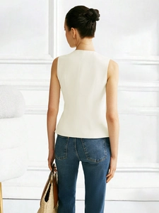 Back view of a white slim fit sleeveless vest with elegant tailored waistline detail