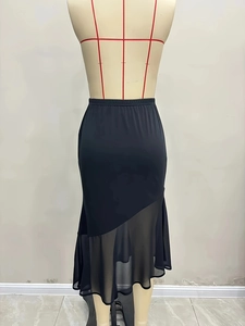 Elegant black high-waisted fishtail skirt featuring mesh splice hem and elastic waist