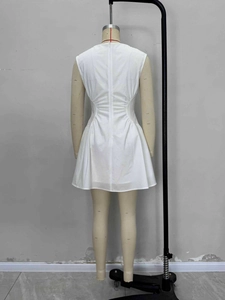 Elegant white sleeveless French style dress with waist pleats and A-line silhouette