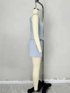 Side view of light blue sleeveless vest set featuring utility pockets and wide-leg shorts