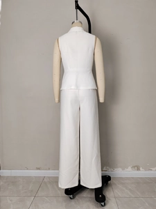 Back view of women's white two-piece suit with sleeveless waist vest and wide-leg pants