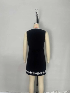 Slim fit V-neck sleeveless black mini dress with white embroidery on the back view