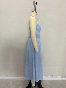 Detail shot of light blue pleated fabric texture on a slim fit sleeveless dress