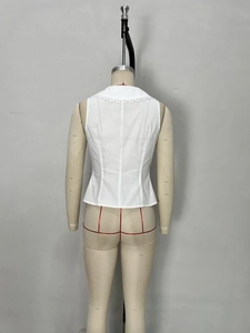 Elegant white sleeveless vest with intricate lace trim neckline on a mannequin back view