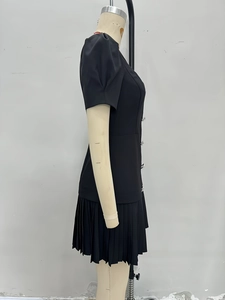 French vintage style little black dress with puff sleeves and pleated skirt design