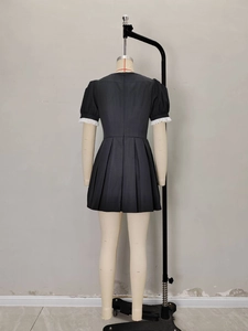 Retro black square neck mini dress with white ruffle cuffs and pleated A-line skirt