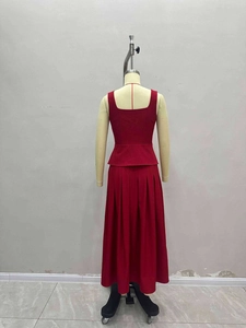 Elegant red two-piece sleeveless peplum top and high-waist pleated maxi skirt set for women