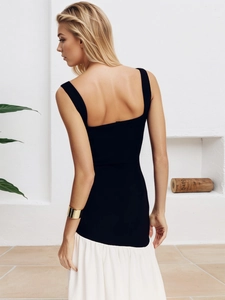 Detail of elegant black backless dress with wide straps and square neck for women