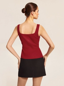 Detail showing the square neck and fitted back tailoring of the burgundy sleeveless top