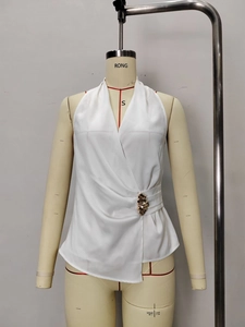 White satin V-neck sleeveless wrap top with elegant waist buckle and asymmetric hem