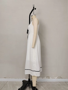 Summer sleeveless white midi dress with sailor collar and black bow tie accent