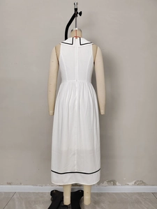 White sleeveless maxi dress with sailor collar and black stripe trim on hem and neck