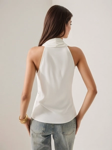 Back view of elegant white satin halter top with slim fit and subtle glossy finish