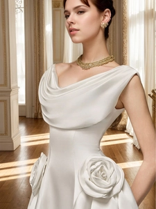 Detail of 3D rose floral waist accent and pleated satin neckline on a white dress