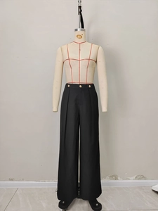 Women's black high-waisted wide-leg trousers with elegant golden buttons and vertical pleats