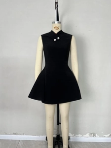 Sleeveless black mini dress with asymmetric collar and silver button details