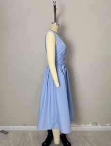 Detailed side view of light blue sleeveless dress with waist pleats and A-line skirt