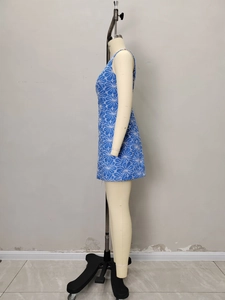 Detailed side view of sleeveless blue dress with white floral pattern on a mannequin