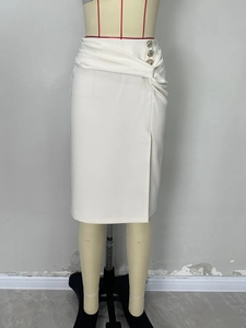 Elegant white midi skirt featuring a side slit and decorative gold embossed buttons