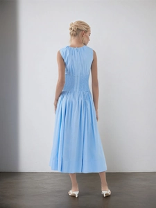 Elegant light blue sleeveless midi dress with smocked waist and round neck back view