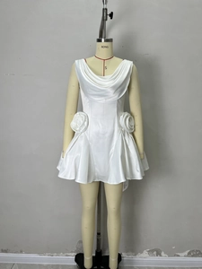 White satin mini dress featuring 3D floral accents and elegant draped neck detail