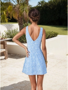 Light blue sleeveless mini dress with white floral embroidery and backless V-neck design