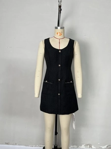 Elegant black sleeveless tweed mini dress featuring pearl buttons and chic front patch pockets