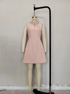 Sleeveless pale pink A-line dress featuring a luxurious rhinestone collar and smooth fabric