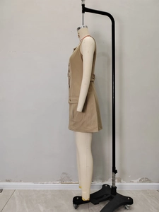 Khaki sleeveless utility dress with lapel collar and side pockets on a mannequin