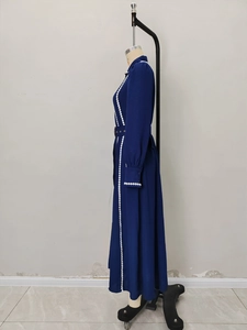 Elegant dark blue long sleeve waist-tie dress with white wavy trim and metal button detail