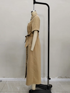 Detailed side view of khaki short sleeve shirt dress with collar and waist belt