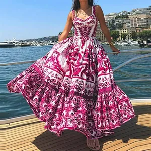 Detail of Mediterranean pink floral maxi dress on a yacht with a flowing skirt