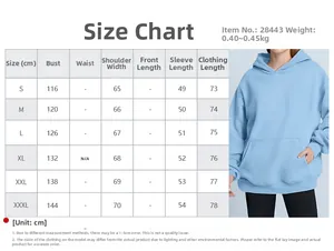 Detailed size chart for oversized light blue hooded sweatshirt with front pocket design