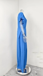 Side view of royal blue short sleeve wide leg jumpsuit with high waist design detail