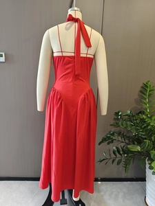 Detail of red halter dress back showing delicate straps and invisible zipper closure