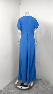 Detail of blue short sleeve jumpsuit showing invisible back zipper and high waist cut