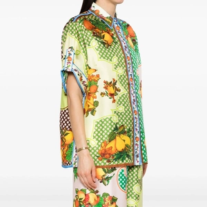 Detailed side view of silky set with Mediterranean fruit prints and polka dot texture