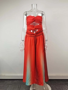 Detail of red hollow-out twisted bodice and gradient maxi hemline on vacation dress