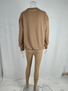 Rear view of khaki two-piece knit set featuring loose sweatshirt and ribbed leggings