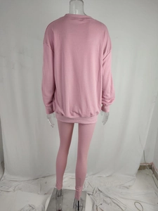 Rear view of pink women's tracksuit set with round neck sweatshirt and athletic leggings