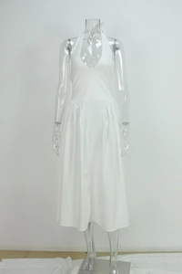 Detailed view of the elegant deep V-neck and halter neckline on this white midi dress