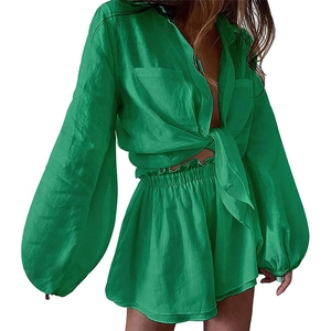 Women's green two-piece linen set with lantern sleeve tie-up shirt and high waist shorts