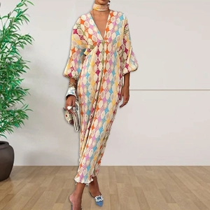 Detail of elegant V-neck maxi dress with colorful geometric diamond print and balloon sleeves